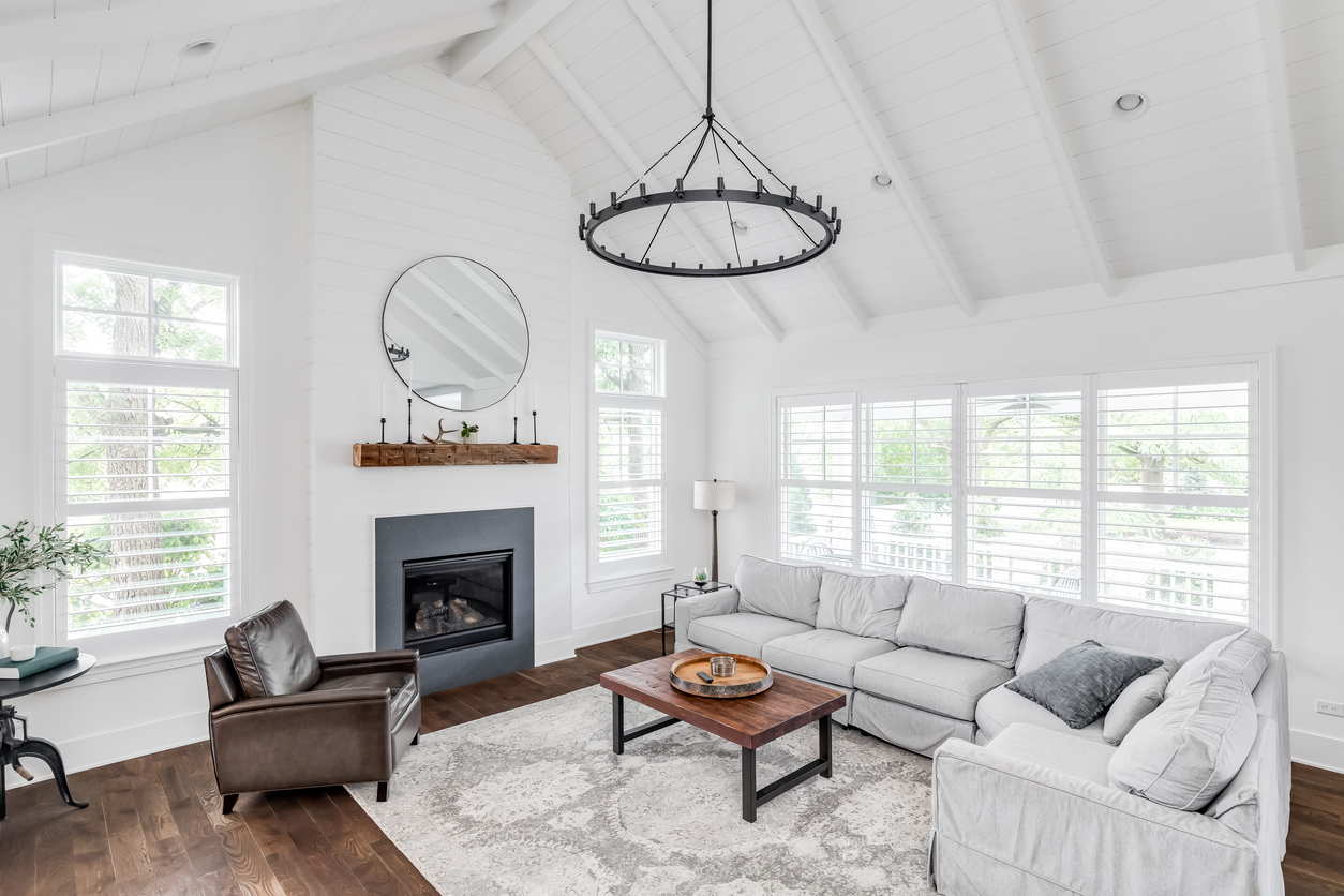 Vaulted living room with fireplace and shiplap ceiling